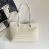 Bolsa tote com textura tecida transfronteiriça feminina cor sólida em relevo grande capacidade para o dia a dia bolsa de ombro único temperamento simples bolsa de axila moderna