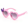 Óculos de Sol Infantis Novedosos e Únicos em Formato de Coração para Meninas com Laço, Óculos de Sol para Bebês com Lentes em Formato de Coração, FDA CE