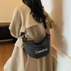 Bolso Bandolera Impermeable de Nailon Tipo Dumpling para Mujer 2026 Nuevo Estilo Ligero Acolchado Pequeño Bolso de Hombro Bolso de Mano Nicho Sensación de Alta Gama