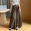 Nuevo estilo de otoño, pantalones-falda plisados de cintura alta elástica con cinturón, de caída fluida y diseño único para mujer