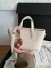 Bolsa de balde versátil e estilosa para uso transfronteiriço, bolsa de ombro e transversal moderna para o dia a dia e para o trabalho, bolsa de mão de nicho minimalista e moderna