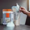 Proteína de suero en polvo sabor vainilla para productos transfronterizos Proteína en polvo de vainilla 560G/lata
