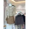 Falda midi de mezcla de lana gris para mujer otoño/invierno 2026, falda corta nueva de cintura alta, falda de invierno súper elegante para combinar con un abrigo
