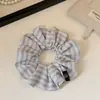 Goma de pelo a rayas versátil y elegante para moño o cola de caballo, Accesorio para el cabello de celebridad de Internet a la moda