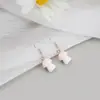 Pendientes de metal de aguja plateada con forma de corazón y estrella de ocho puntas Pendientes de estrella de nicho europeos y americanos Estilo dulce y fresco Pendientes de chica popular Venta al por mayor