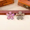 Brocado Song de cinco pétalos de flor de cerezo acabado en el pecho puntada colorida tela de brocado Song broche de flor de cerezo de aleación accesorios de ropa de estilo antiguo lote mixto