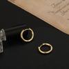 Pendientes pequeños de estilo nuevo para dormir con anillo dorado mini circular para el cartílago de la oreja, hebilla simple brillante para la oreja, pendientes de aguja de plata 925