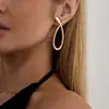 Accesorios de Moda Transfronterizos Europeos y Americanos, Elegantes Pendientes de Línea Geométrica en Forma de S, Pendientes de Botón Minimalistas Redondos Lisos de Aleación