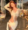 Traje de baño para mujer de playa de comercio exterior, nuevo estilo coreano, color liso, conjunto de cuatro piezas, bikini sexy de malla de manga larga, traje de baño para mujer de vacaciones