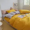 Venta al por mayor de fábrica Juego de cuatro piezas de algodón lavado de color liso Funda de edredón cepillada simple Estilo Ins Sábana de cama Juego de ropa de cama de tres piezas 3