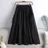 Falda 2023 nueva verano estilo coreano color liso con cordón de amarre bolsillo longitud media talla grande ropa de trabajo falda línea A para mujer