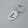 Venta Caliente de Productos Nuevos Transfronterizos 26 Letras Inglesas Huecas de Acero de Titanio Sin Decoloración Accesorios de Joyería Llavero 26 Letras