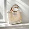 Bolso de mano tejido a mano artístico calado de nicho transfronterizo, bolso de hombro versátil, bolso de playa de gran capacidad para vacaciones junto al mar