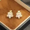Brincos Estilo Coreano Estrela de Cinco Pontas Exquisitos Cravejados com Pedras Banhados a Ouro Bicolor Versáteis Elegantes Brincos de Clipe para Orelha Não Perfurada para Mulheres