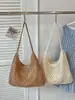 Bolsa de Palha Casual de Grande Capacidade para Mulheres 2026 Novo Estilo Bolsa de Ombro Vazada Estilo Preguiçoso Fashionável Elegante Bolsa de Praia para Férias