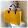 2026 Nuevo Modelo Año de la Serpiente Bolsa de Fieltro Regalo de Año Nuevo Souvenir Bolso Tote de Fieltro Personalizado Varios Regalos de Fieltro
