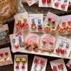 Pendientes de Clip de Resina Coloridos Lindos con Forma de Personaje de Dibujos Animados para Niñas, Accesorios de Pendientes de Lazo Corazón Explosivo