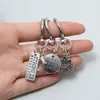 Llavero colgante retro de aleación del Árbol de la Vida con trébol de la suerte y letra, accesorio para mochila, superventas transfronterizo de Amazon