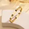Pulsera de acero de titanio transfronteriza moda simple para mujer europea y americana con baño de horno oro real 18K acero inoxidable 6mm pulsera lisa