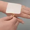 Tejido No Tejido Spunbond de Tres Capas Parche Hueco para el Ombligo, Parche Hueco para Puntos de Acupuntura, Parche de Yeso en Blanco, Parche de Cinta Adhesiva Transpirable, Fabricante de Origen
