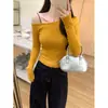 Camiseta amarilla de manga larga única, hermosa y elegante para mujer, otoño 2026, hombros descubiertos, top asimétrico