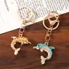Nuevo llavero de delfín con incrustaciones de diamantes estilo coreano, lindo y personalizado accesorio para bolsa, colgante creativo de animal marino, pequeño regalo