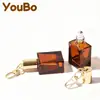 Frasco de Vidro Transparente Marrom Quadrado Plano com Rolo 10ml 15ml Frasco Pingente para Óleo Essencial Frasco de Perfume Frasco com Rolo para Creme para Olhos Óleo Labial
