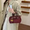 Bolso de moda de gran capacidad estilo coreano para mujer, nueva colección 2026, con diseño de bolso Kelly estampado de lichi, bolso de mano simple y de color sólido