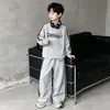 Conjunto deportivo de dos piezas a rayas casual estilo coreano para niños mayores, nuevo atuendo de moda de otoño holgado para niños