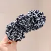 Pinza de plátano con estampado de leopardo retro coreano Pasador elegante en la parte posterior de la cabeza Nuevo estilo perezoso Accesorios para el cabello de alta gama