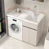 Gabinete de lavandería para balcón de aluminio tipo panal con lavadora integrada, incluyendo una tabla de lavar y un fregadero de piedra de cuarzo artificial con una barrera de agua