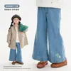 Jeans para niña estilo coreano con bordado en la pierna Nuomi Wanzi 2026 Otoño, ropa infantil de Huzhou Zhili, pantalones acampanados para niños