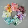 Bolsa de material para flores artificiales Una caja de flores con flores Horquilla para el cabello Xunpu flor Tocado de minoría étnica para hacer sombreros y pantuflas decoración