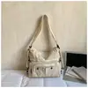 Bolsa de Tecido Artística com Múltiplos Bolsos Estilo Coreano Nova Primavera 2026 para Mulheres, Mochila Tote de Ombro Único Transversal para Comutador Estudante