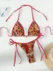 Traje de baño de dos piezas estilo europeo y americano hecho a medida para mujer, diseñado para exportación y ventas transfronterizas, con cuello halter y diseño de amarre, un bikini de triángulo sexy