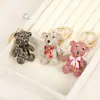 Colgante de Mochila de Oso de Diamantes Completos Coreano Nuevo Llavero de Coche Colgante de Aleación con Lazo de Color Wholesale de Yiwu