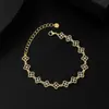 Pulsera simple y a la moda con trébol de la suerte y flor de diamante incrustado cruzado, pulsera de lujo ligero estilo europeo y americano, joyería de mano de nicho de alta gama.