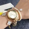 Popular en el comercio exterior, reloj de pulsera de metal con dibujos animados con pequeños puntos y marcas de color rosa claro, compacto, de nicho, simple e impermeable