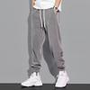 Pantalones de pana casuales para hombre, forrados de vellón para otoño e invierno, pantalones deportivos versátiles, pantalones deportivos gruesos, sueltos y cálidos con cordones en los tobillos.