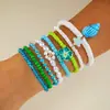 Conjunto de pulseiras de férias estilo boêmio transfronteiriço europeu e americano, pulseira multicamadas com sementes, concha e estrela-do-mar