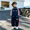 Conjunto Deportivo de Otoño para Niños 2026 Nuevo Estilo Moda Infantil Atractivo Chaqueta de Dibujos Animados Pantalones Ropa de Primavera y Otoño Conjunto de Dos Piezas