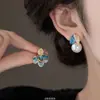 Aretes Asimétricos de Esmalte Glaseado Sentido Avanzado Diamante Incrustado Hojas Aretes de Perla para Mujer 2025 Explosiones Estilo de la Corte China