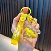Llavero de Muñeca Oceánica Rellena de Aceite Dibujo Animado Animal Pequeño Pez Botella de Arena Movediza Colgante de Bolso Pequeño Regalo