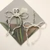 Japonés y Coreano Simple Versátil Perla Artificial Cristal Lazo DIY Bolsa Colgante para Teléfono Hebilla de Zapato Flor de Zapato Accesorios para Pendientes