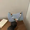 Comércio exterior com miçangas 2026 verão novo jeans moda leve corrente de pérola tecida bolsa de ombro axila