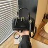2026 Nuevo Bolso de Mano de Lujo Ligero Estilo Old Money Textura Tejida Bolso Bowling Bolso Cruzado para Mujer Nicho Boston Almohada