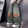 Nueva colección de otoño y primavera: Pantalones vaqueros degradados para niños, con un diseño de grafiti desgastado y pintado en spray, creando un pantalón largo ancho moderno y cómodo para niños mayores.