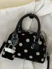 Bolso Shuai Mi Jia elegante y moderno de nicho de lunares para mujer, nuevo bolso cruzado de otoño 2026 para el trabajo, bolso de mano, bolso almohada