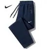 Pantalones de chándal holgados de pierna recta para hombre, talla grande, para primavera y otoño, joggers modernos con bolsillo y cremallera, pantalones casuales elegantes para hombre