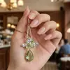 Estilo Nuevo de Principios de Primavera "Verde Montaña Primaveral" Pendientes Retro Verdes Florales con Gota de Agua y Borlas, Pendientes de Alta Gama y Lujosos